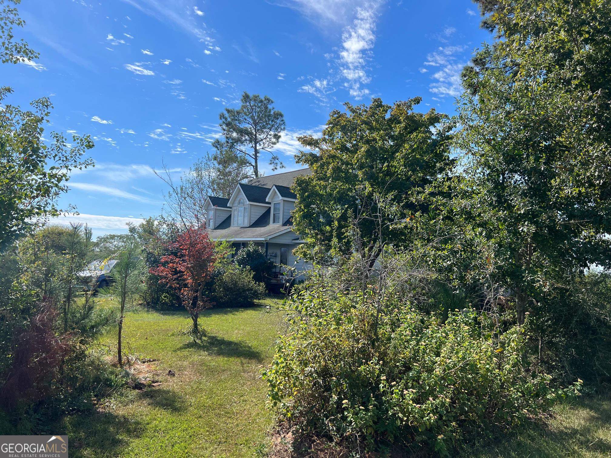 327 Deer Point Road, Unit 492 Georgetown, GA 39854 - Photo 3 of 10 a backyard of a house with lots of green space