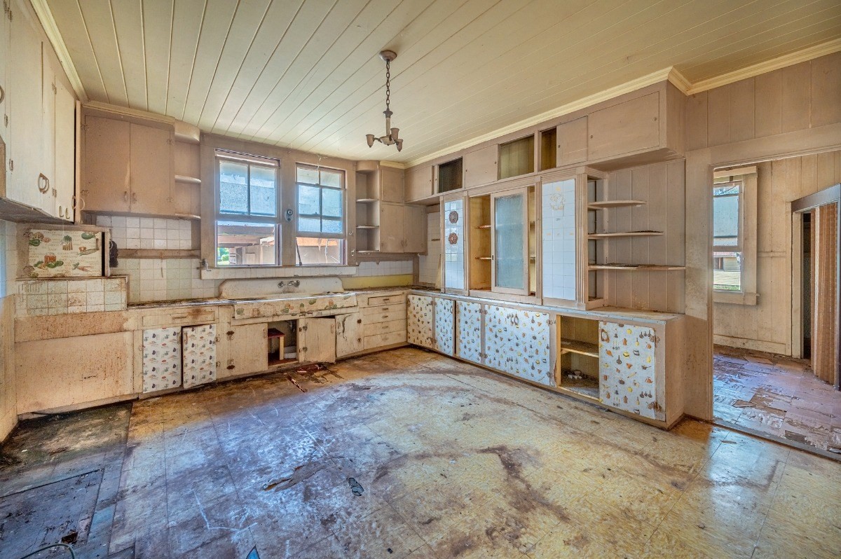 4964 La Road Kapaa, HI 96746 - Photo 15 of 18 a large white kitchen with stainless steel appliances kitchen island granite countertop a stove and cabinets