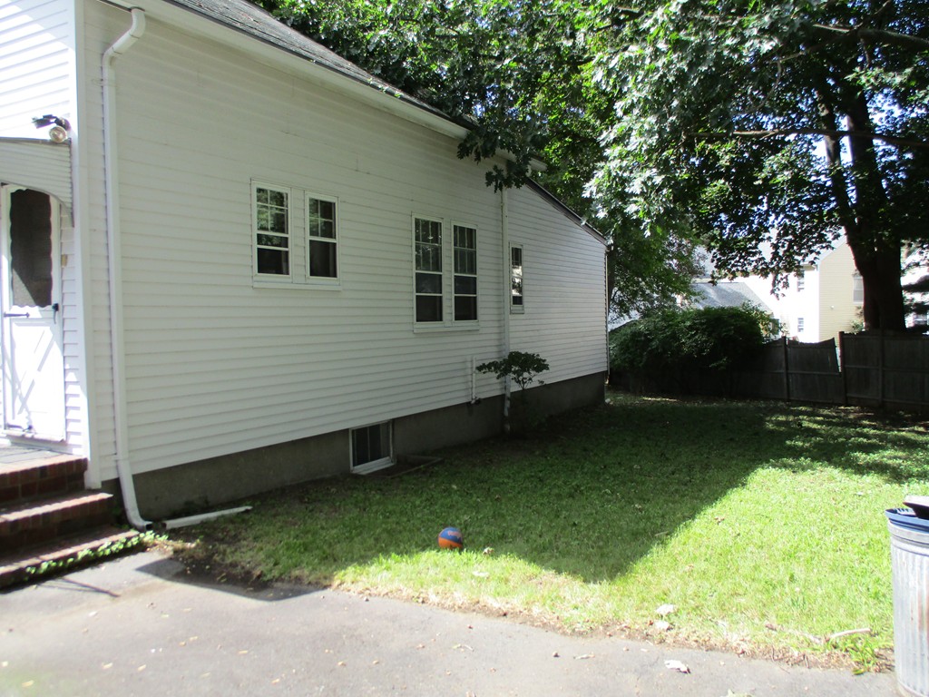 15 Edgewood Road Newton, MA 02465 - Photo 9 of 14 a backyard of a house with lots of green space