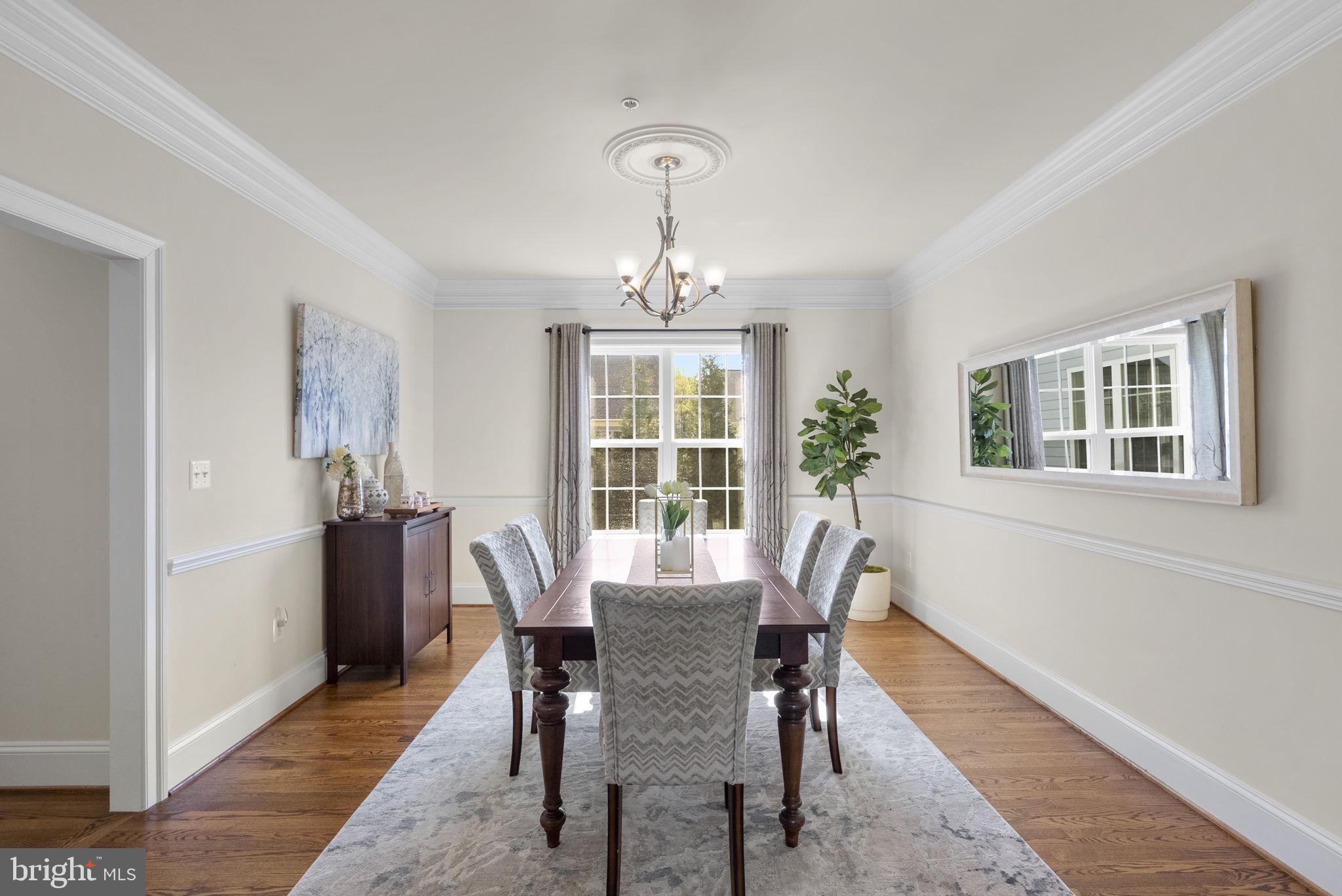 22403 Newcut Road Clarksburg, MD 20871 - Photo 17 of 78 a dining room with furniture a window and wooden floor