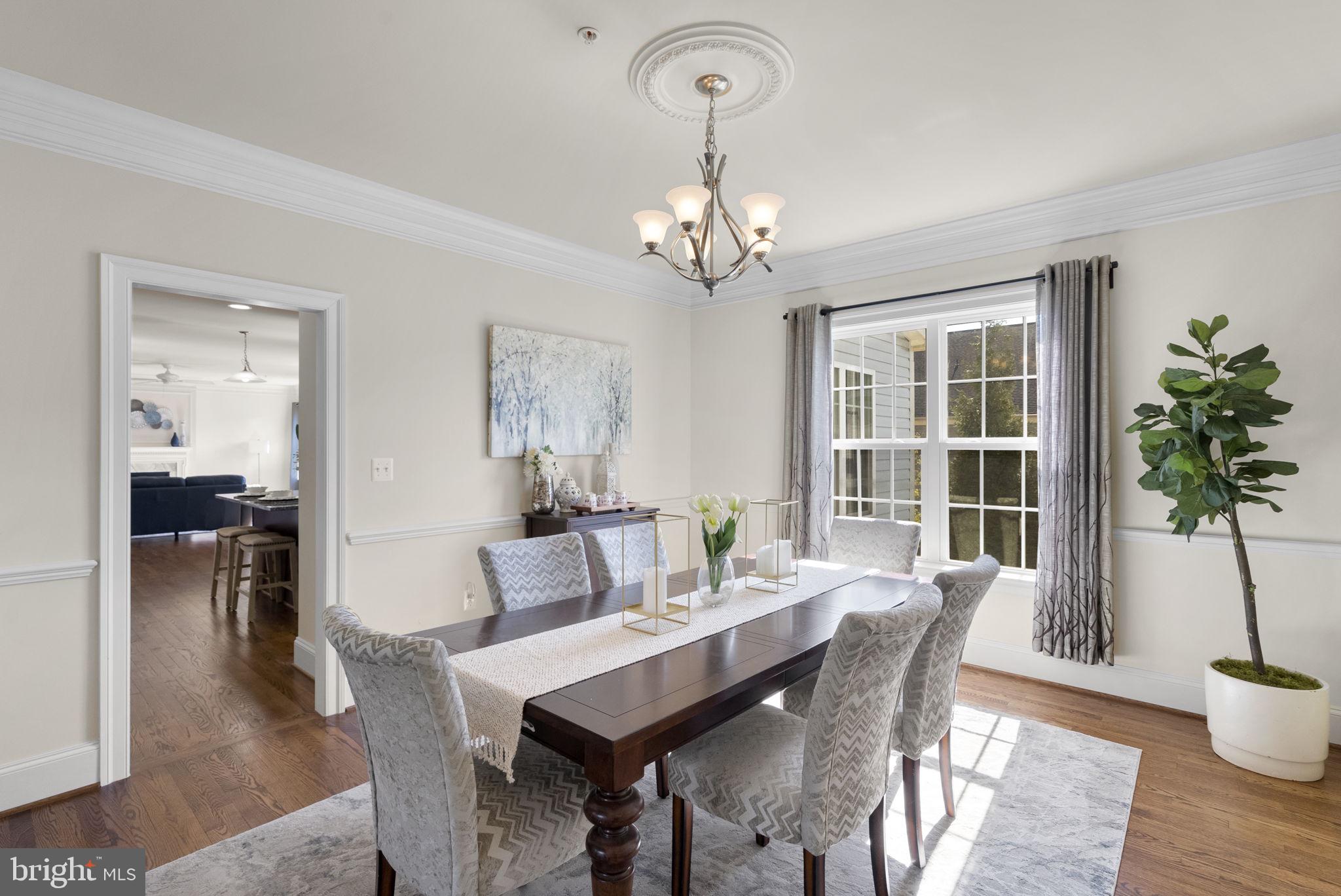 22403 Newcut Road Clarksburg, MD 20871 - Photo 18 of 78 a view of a dining room with furniture window and wooden floor