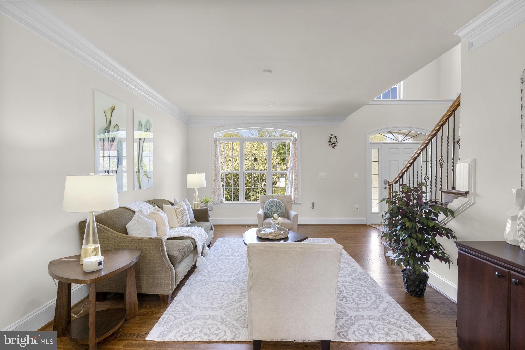 22403 Newcut Road Clarksburg, MD 20871 - Photo 21 of 78 a living room with furniture potted plant and a window