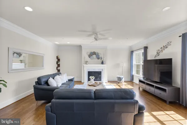 a bedroom with furniture and a large window