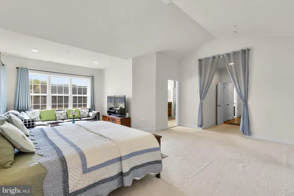 a view of a workspace with furniture and a bedroom