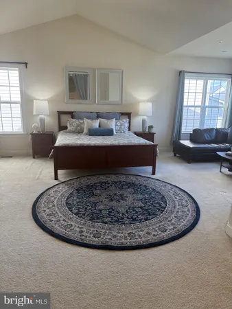 a bedroom with a bed and a night stand