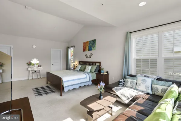 a bedroom with a bed and a closet