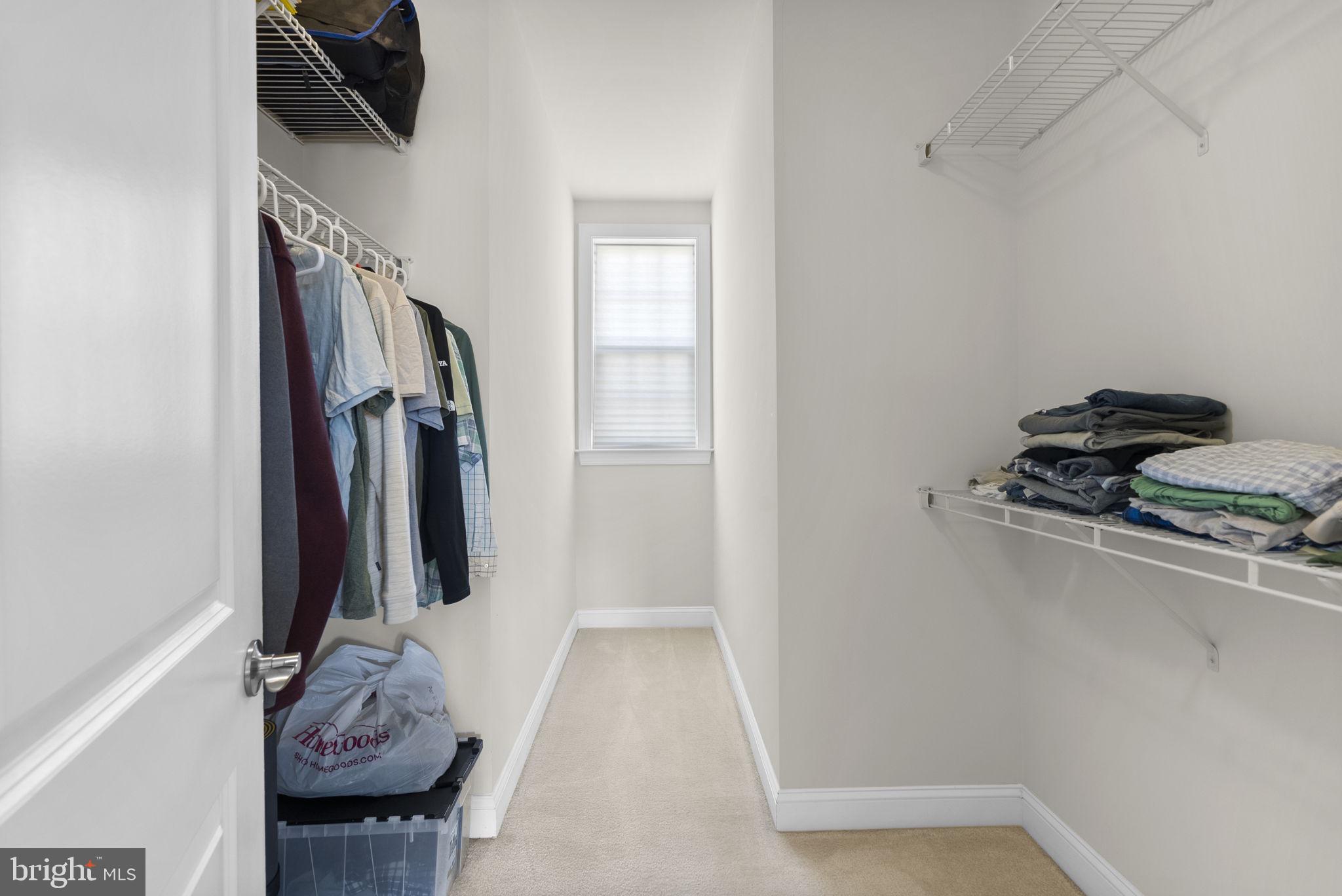 22403 Newcut Road Clarksburg, MD 20871 - Photo 41 of 78 a view of walk in closet with clothes and shoes