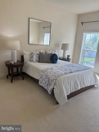 a view of a tall building next to a road