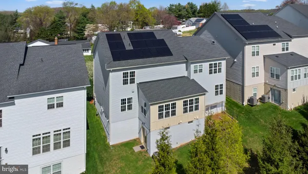 a aerial view of a house with a yard