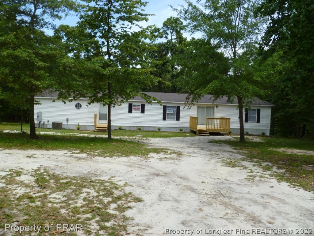 903 Poole Road Raeford, NC 28376 - Photo 1 of 27 a view of a house with a yard