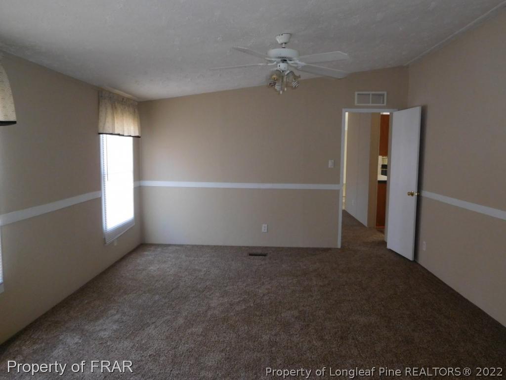 903 Poole Road Raeford, NC 28376 - Photo 14 of 27 a view of an empty room with a window