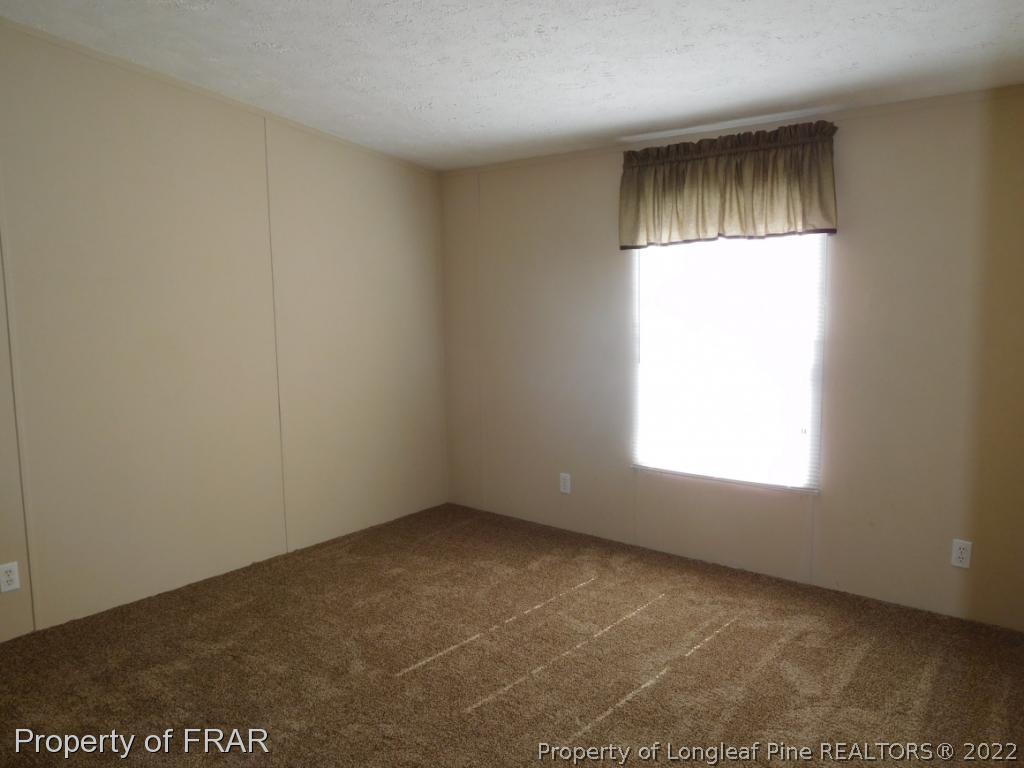 903 Poole Road Raeford, NC 28376 - Photo 20 of 27 an empty room with a window