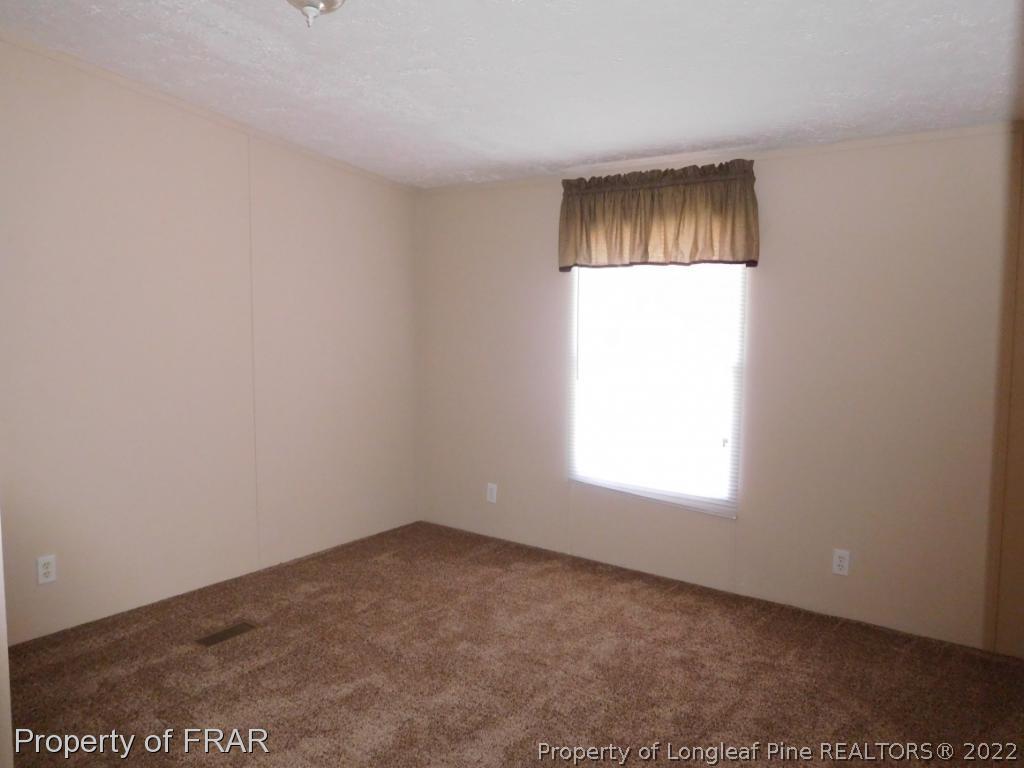 903 Poole Road Raeford, NC 28376 - Photo 22 of 27 an empty room with a window