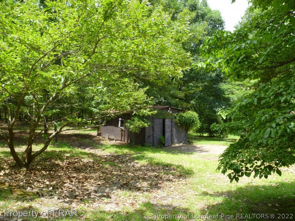 903 Poole Road Raeford, NC 28376 - Photo 26 of 27 a view of a yard with swimming pool