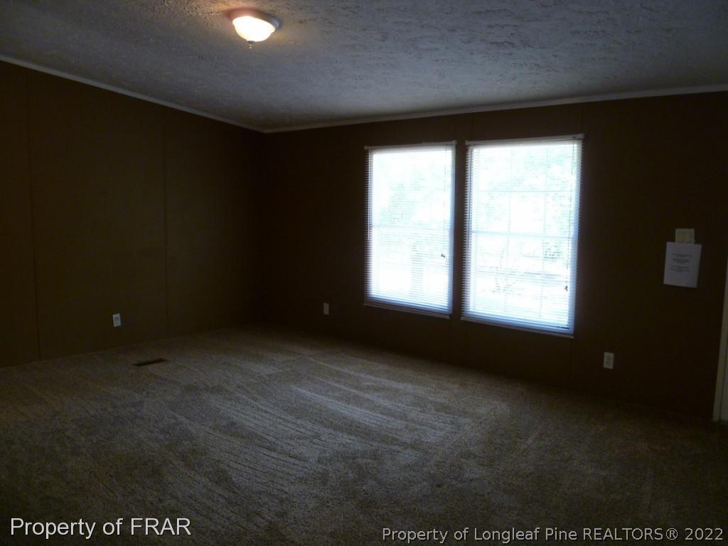 903 Poole Road Raeford, NC 28376 - Photo 3 of 27 a view of an empty room with a window