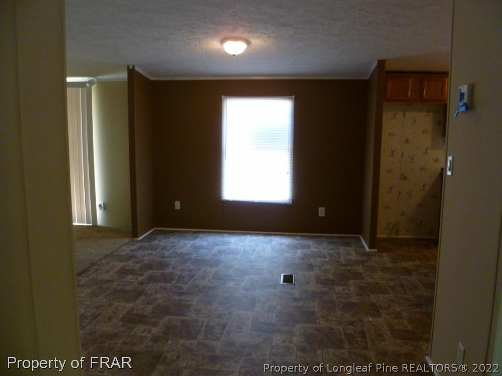 903 Poole Road Raeford, NC 28376 - Photo 7 of 27 a view of an empty room and window