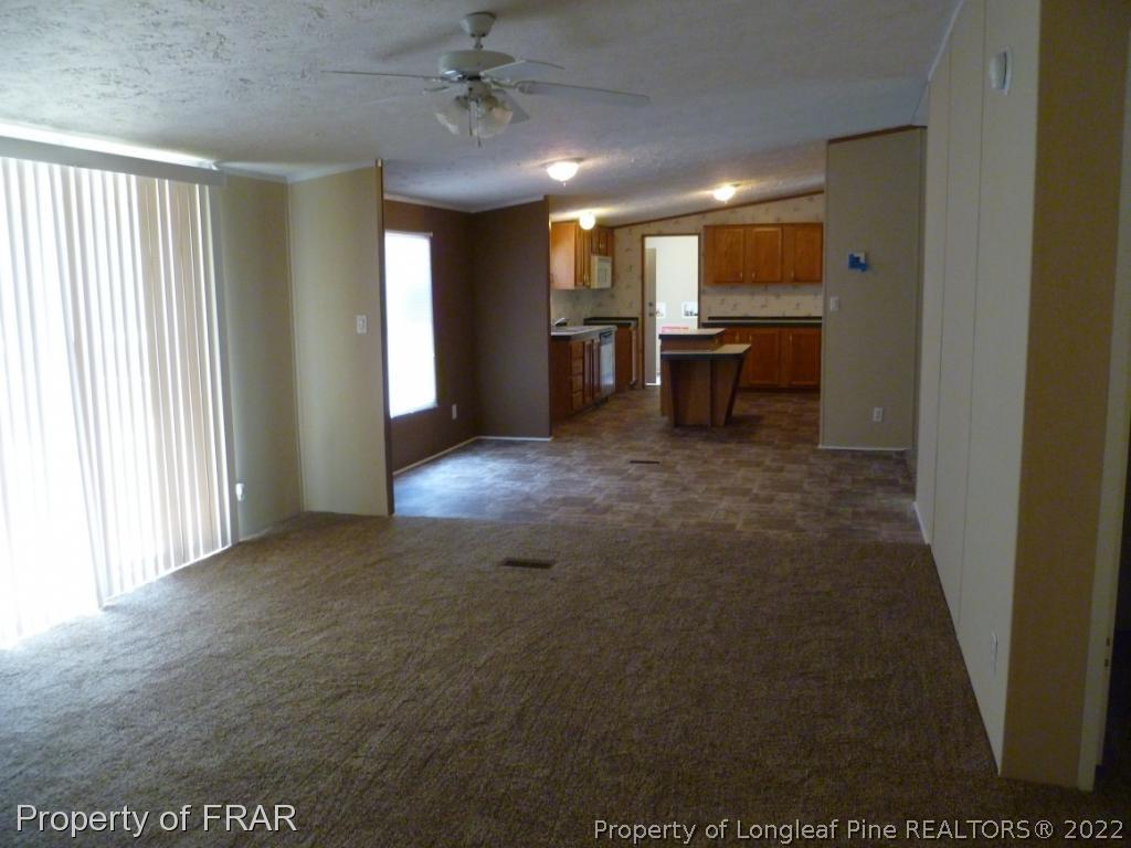 903 Poole Road Raeford, NC 28376 - Photo 8 of 27 a view of an empty room with a kitchen