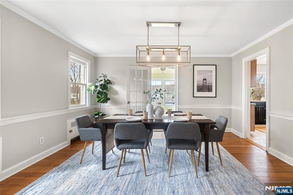 5 Northview Terrace Maplewood, NJ 07040 - Photo 11 of 47 a dining room with wooden floor a chandelier a wooden table and chairs