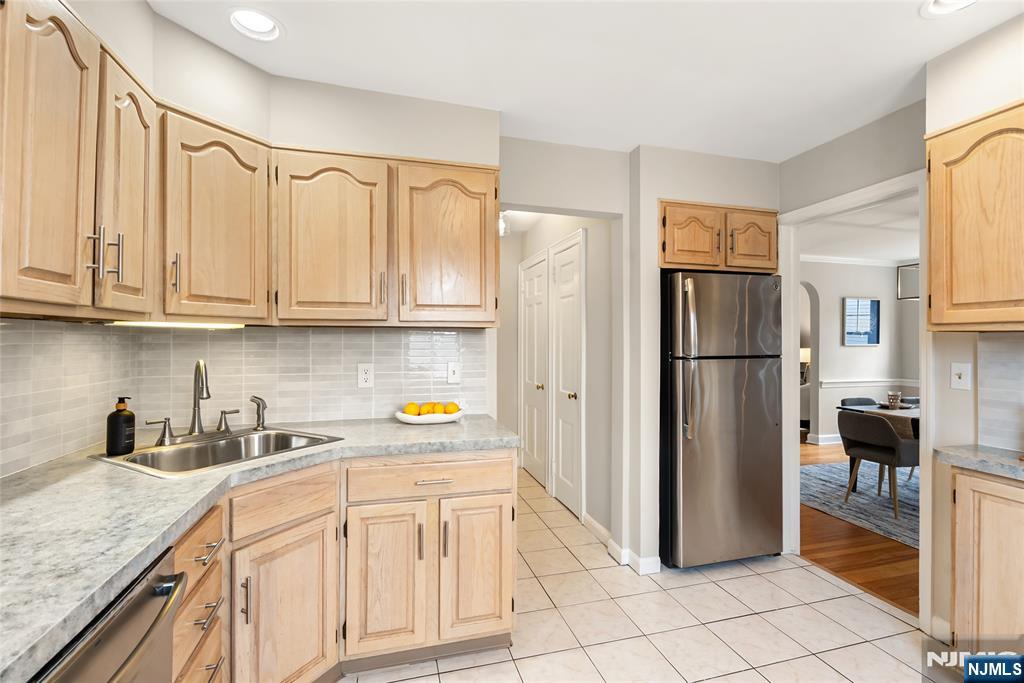 5 Northview Terrace Maplewood, NJ 07040 - Photo 14 of 47 a kitchen with stainless steel appliances granite countertop a refrigerator and a sink