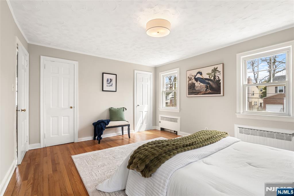 5 Northview Terrace Maplewood, NJ 07040 - Photo 19 of 47 a bedroom with a bed and wooden floor