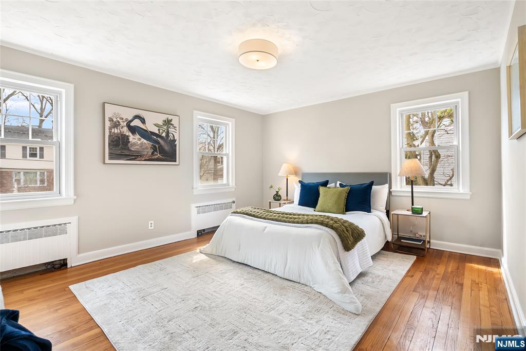 5 Northview Terrace Maplewood, NJ 07040 - Photo 20 of 47 a spacious bedroom with a bed and wooden floor