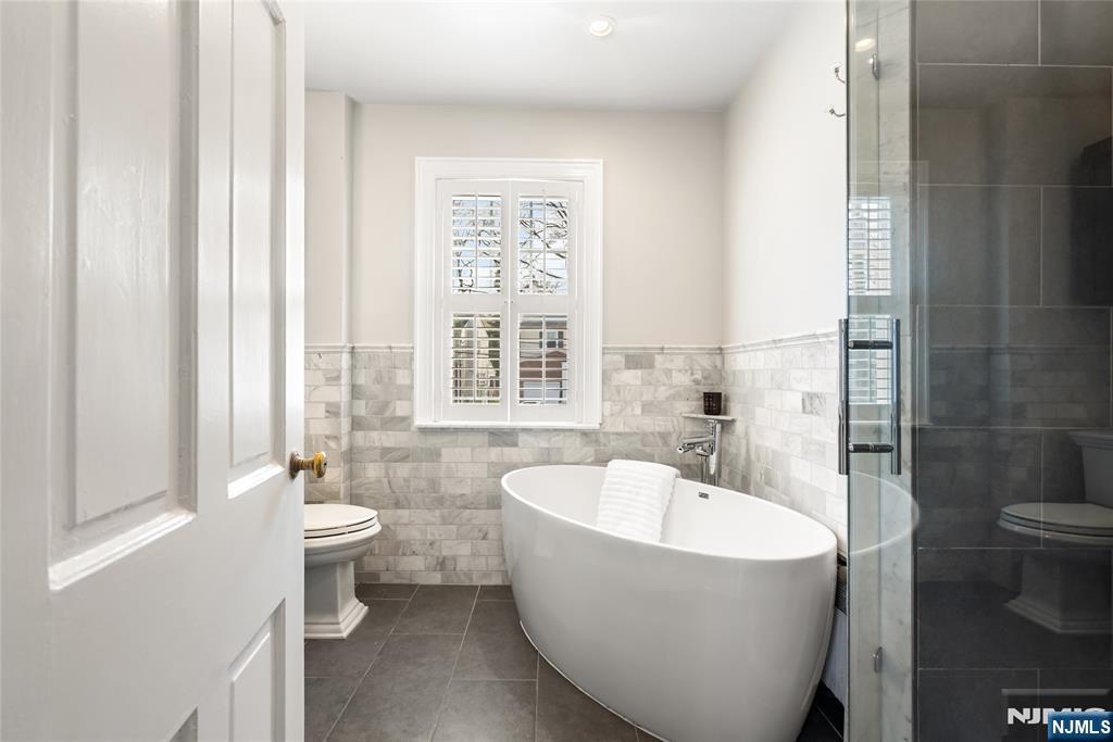 5 Northview Terrace Maplewood, NJ 07040 - Photo 22 of 47 a white bath tub sitting next to a white toilet