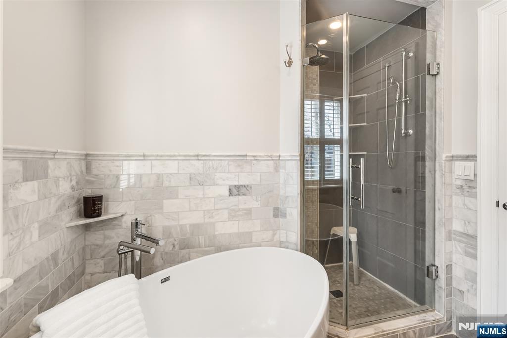 5 Northview Terrace Maplewood, NJ 07040 - Photo 23 of 47 a bathroom with a bathtub and shower