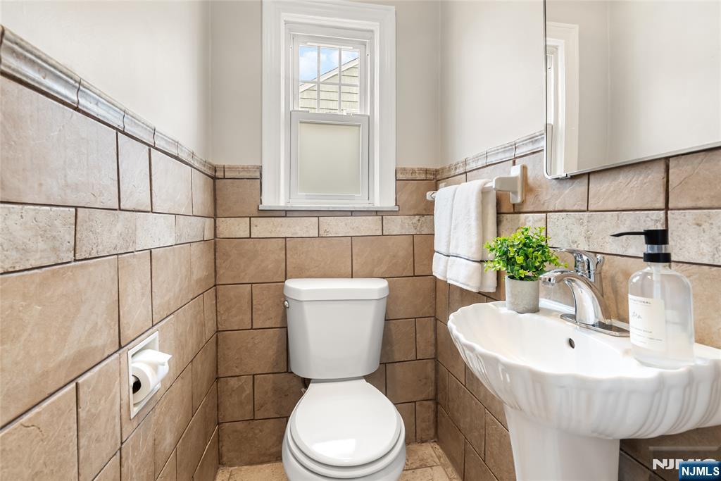 5 Northview Terrace Maplewood, NJ 07040 - Photo 29 of 47 a bathroom with a sink a toilet and a mirror