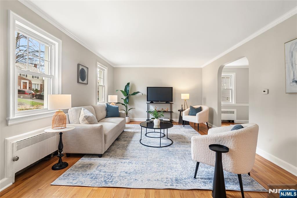 5 Northview Terrace Maplewood, NJ 07040 - Photo 3 of 47 a living room with furniture a flat screen tv and a table