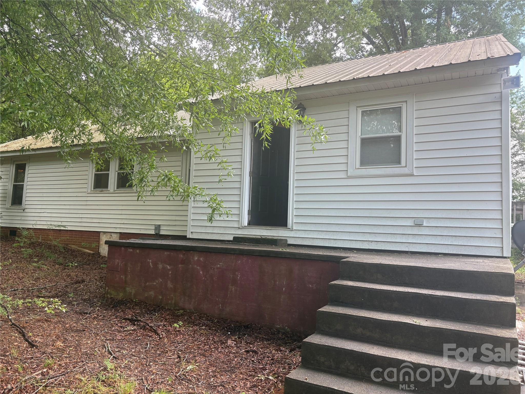 3880 Love Road Claremont, NC 28610 - Photo 3 of 14 a view of a backyard and a tree