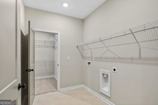 a view of room with a ceiling fan and window