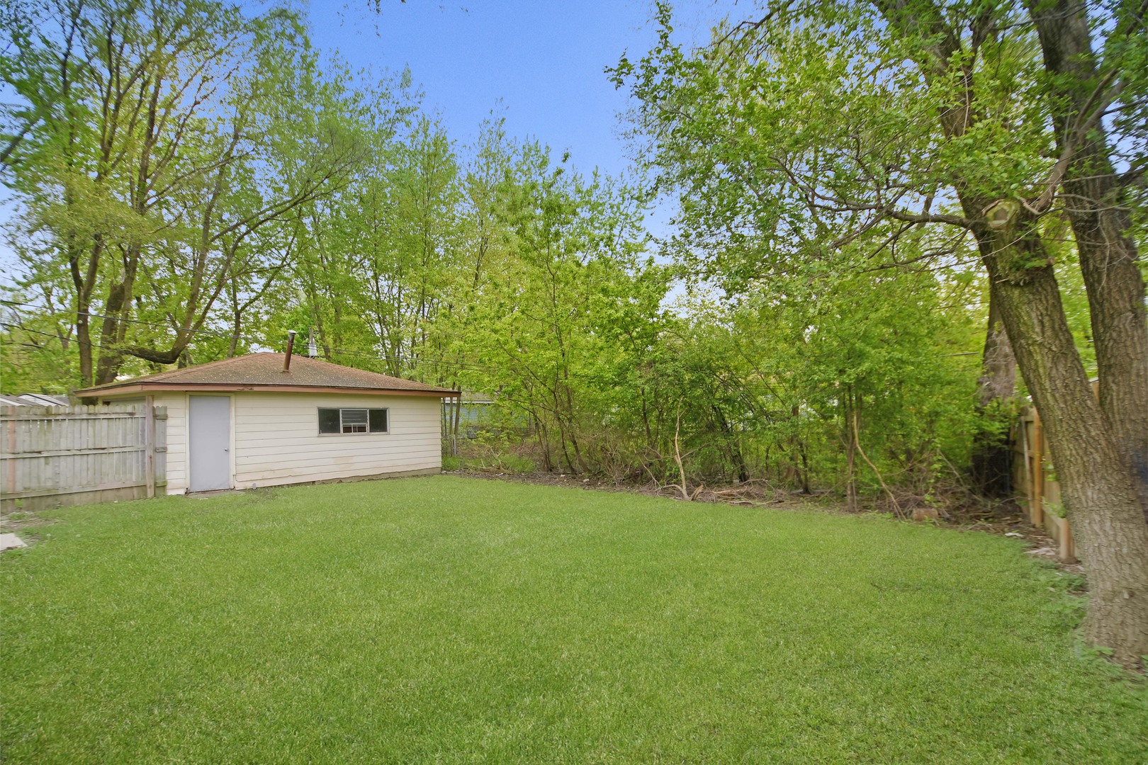 116 Louis Road Joliet, IL 60433 - Photo 12 of 12 a house with green field in front of it