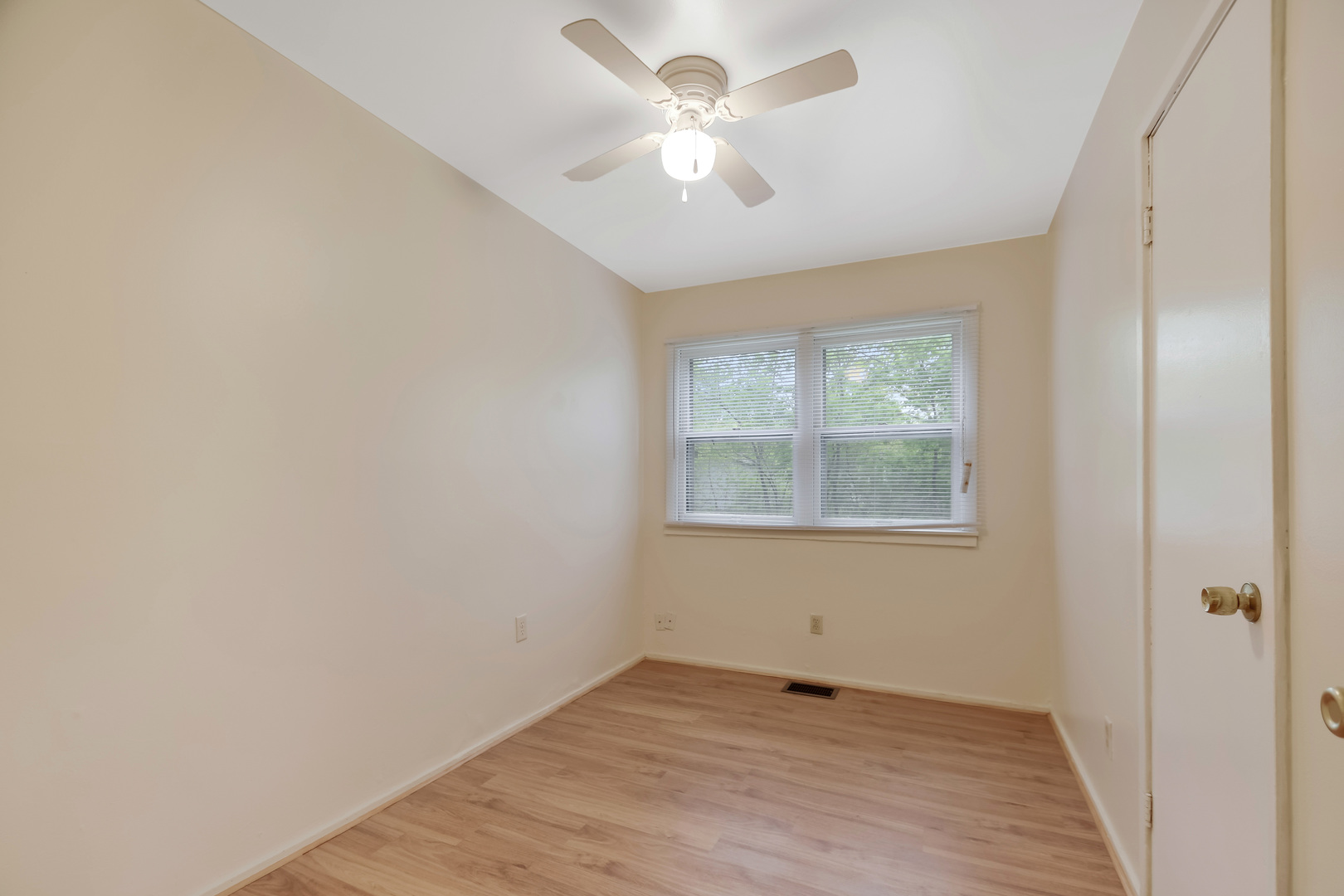 116 Louis Road Joliet, IL 60433 - Photo 8 of 12 a view of an empty room with a window