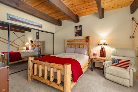 a bedroom with bed and window