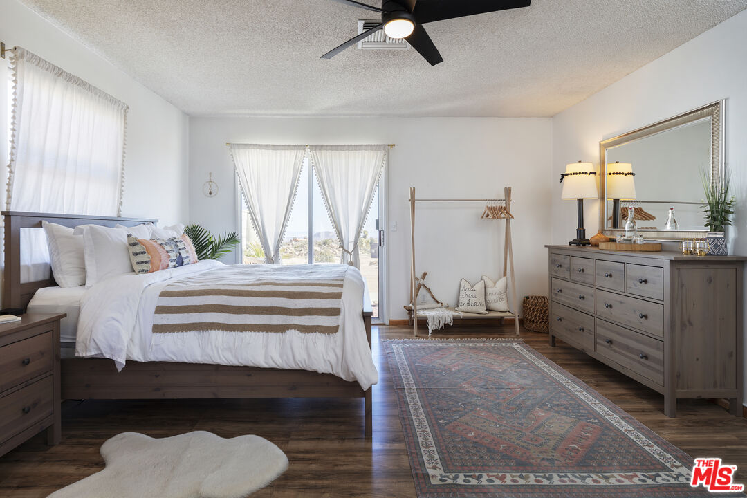 56434 Cobalt Road Yucca Valley, CA 92284 - Photo 21 of 75 a bedroom with a bed and a dresser