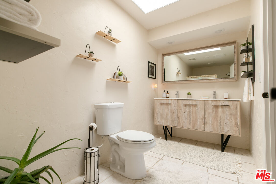 56434 Cobalt Road Yucca Valley, CA 92284 - Photo 24 of 75 a bathroom with a toilet and a shower