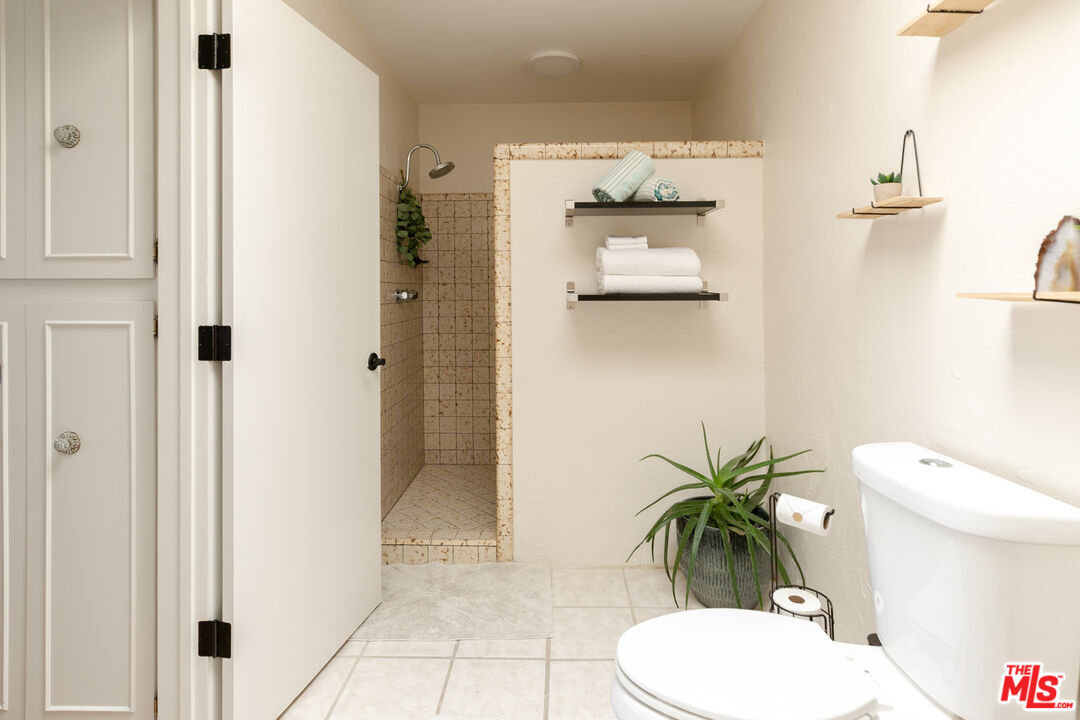 56434 Cobalt Road Yucca Valley, CA 92284 - Photo 25 of 75 a bathroom with a toilet and a shower