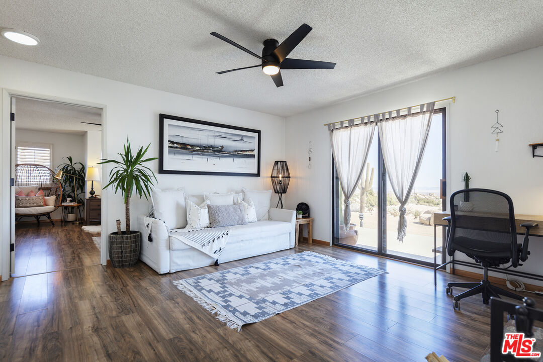 56434 Cobalt Road Yucca Valley, CA 92284 - Photo 42 of 75 a living room with furniture and a wooden floor