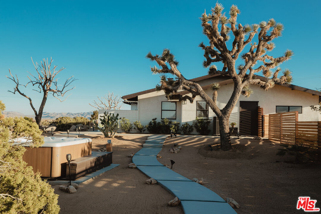 56434 Cobalt Road Yucca Valley, CA 92284 - Photo 50 of 75 a view of a house with many windows