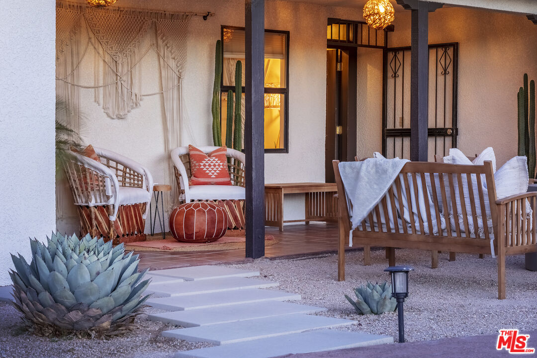 56434 Cobalt Road Yucca Valley, CA 92284 - Photo 60 of 75 a bedroom with furniture and a rug