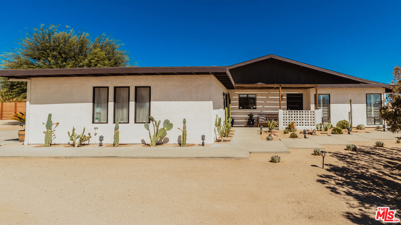 56434 Cobalt Road Yucca Valley, CA 92284 - Photo 61 of 75 a front view of a house with a outdoor space