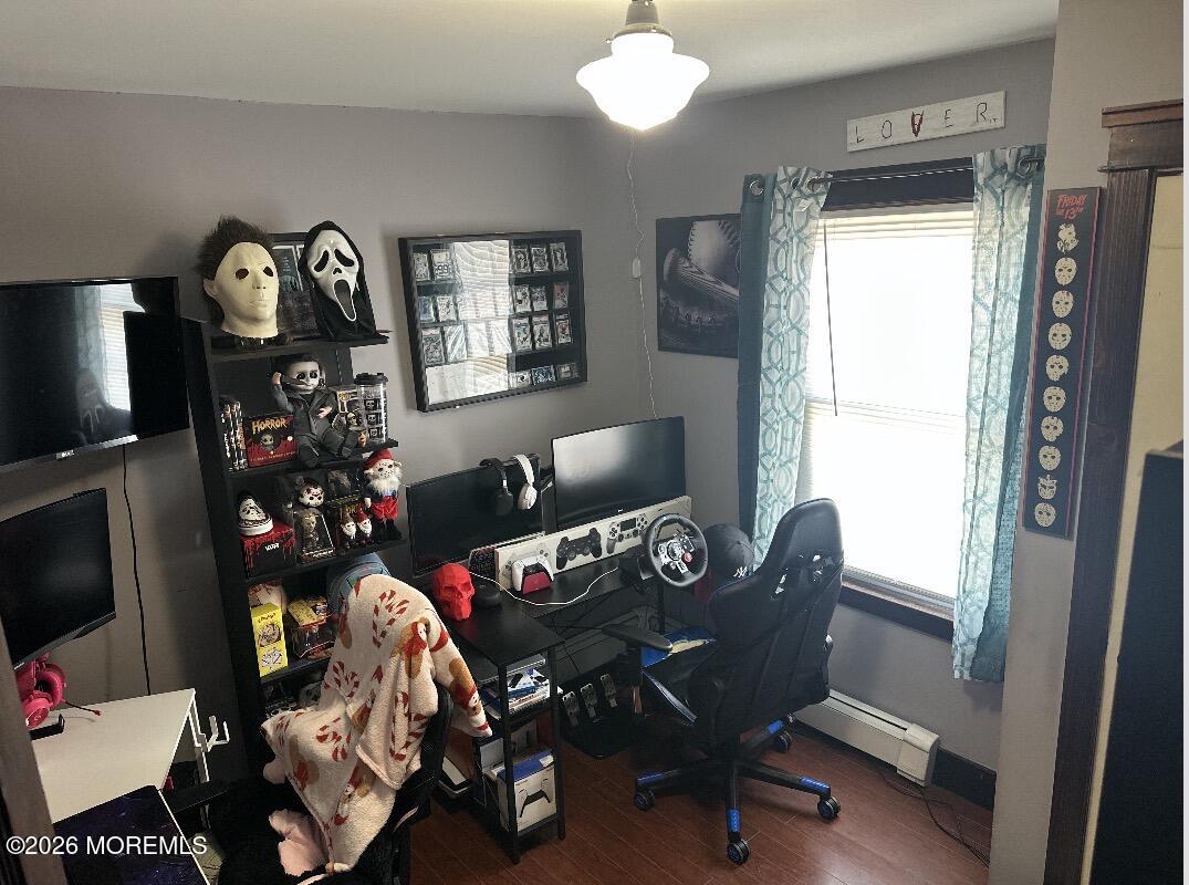 284 Washington Street Keyport, NJ 07735 - Photo 16 of 23 a living room with furniture and a flat screen tv