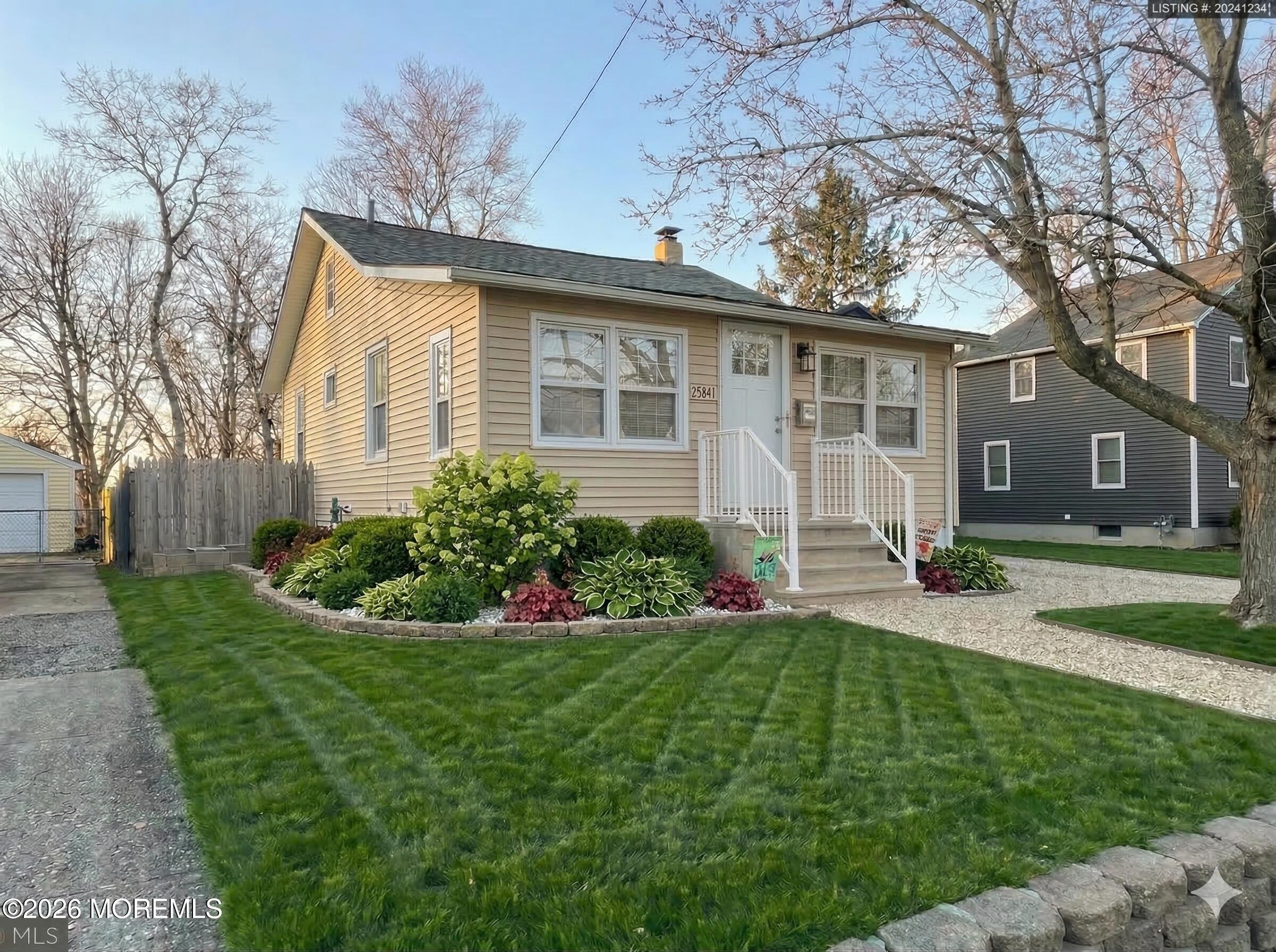 284 Washington Street Keyport, NJ 07735 - Photo 2 of 23 a front view of a house with a yard and trees