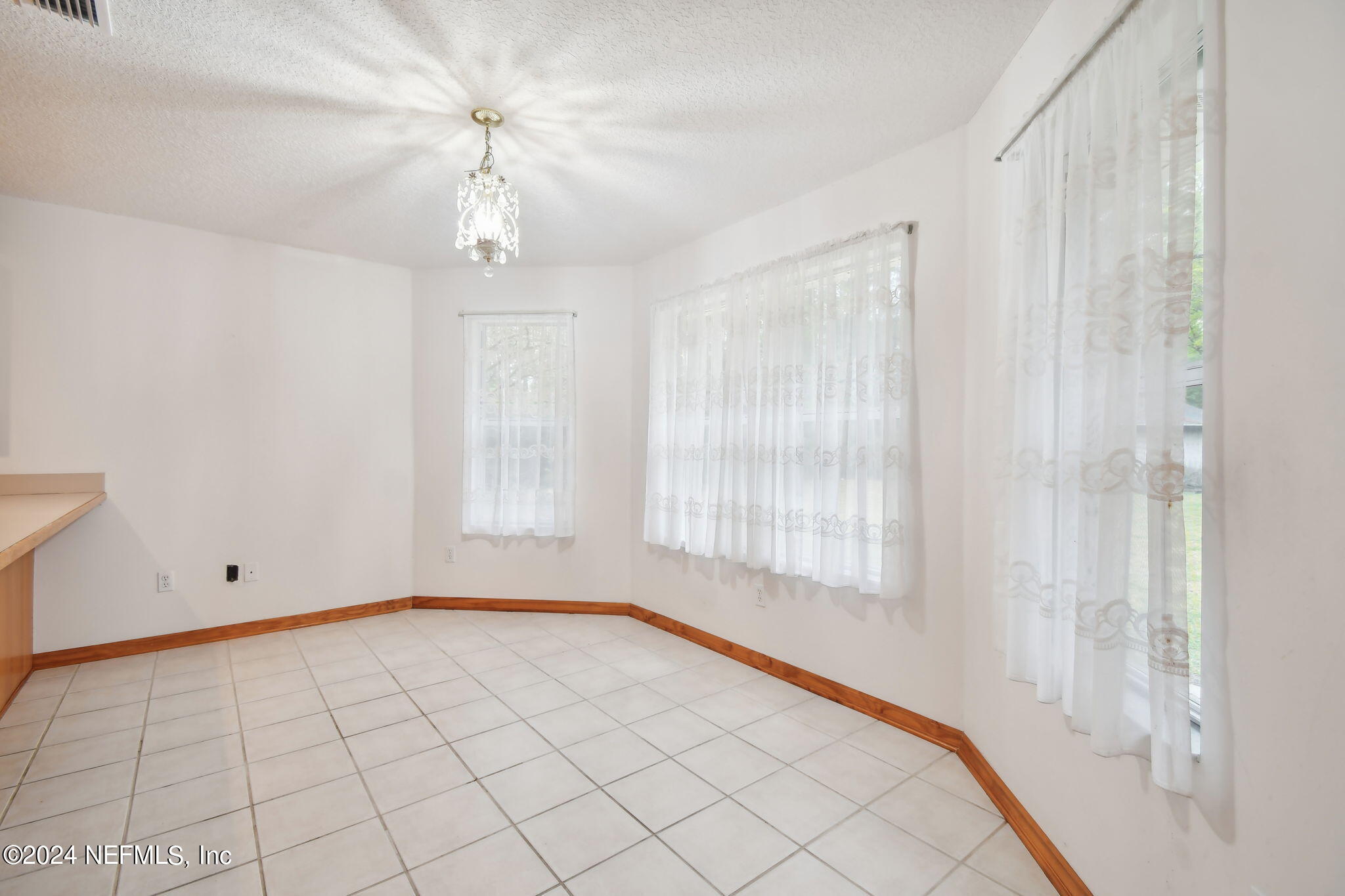 36068 J W Elliott Road Callahan, FL 32011 - Photo 16 of 54 a view of an empty room and a window