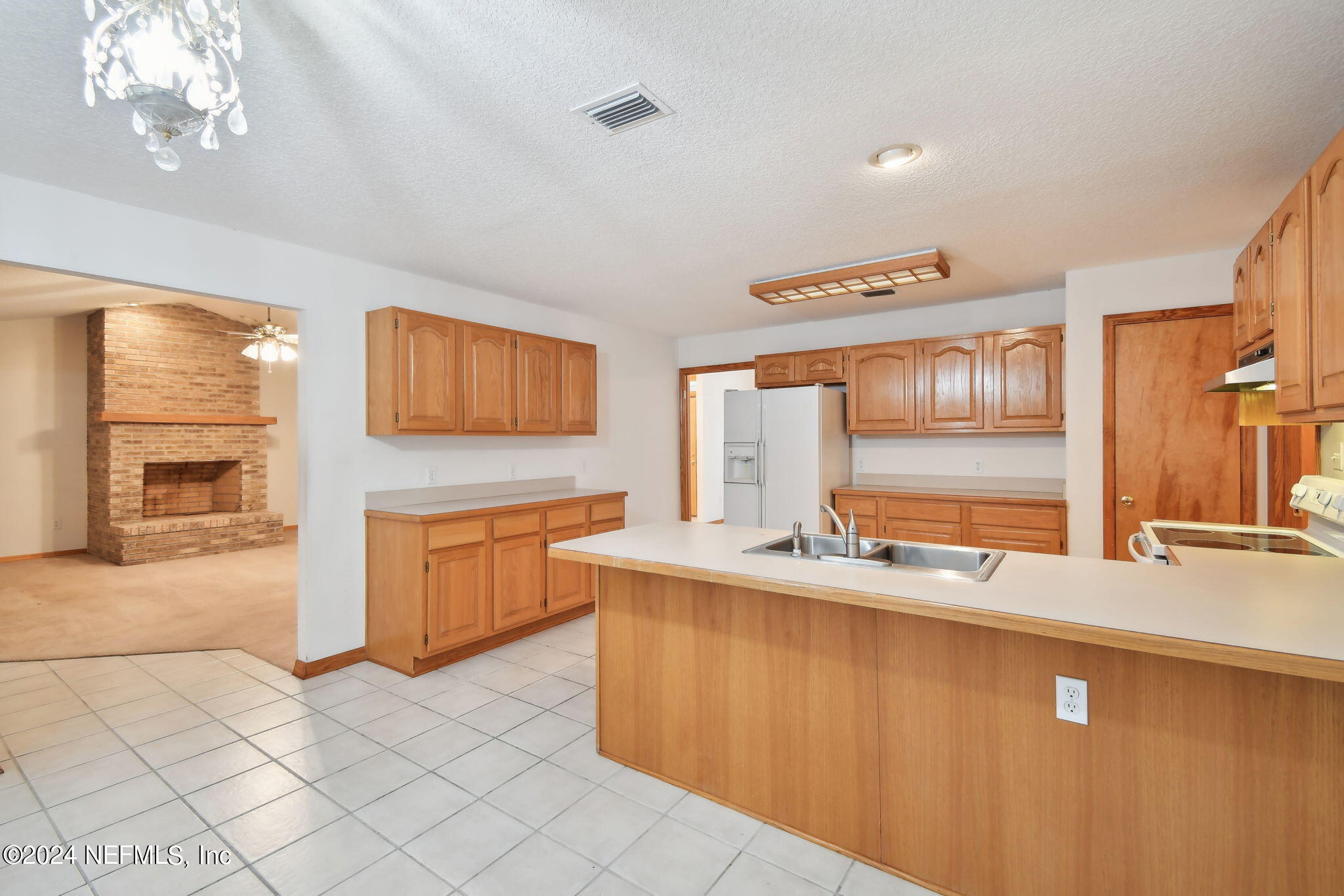 36068 J W Elliott Road Callahan, FL 32011 - Photo 17 of 54 a kitchen with stainless steel appliances granite countertop a sink and a stove
