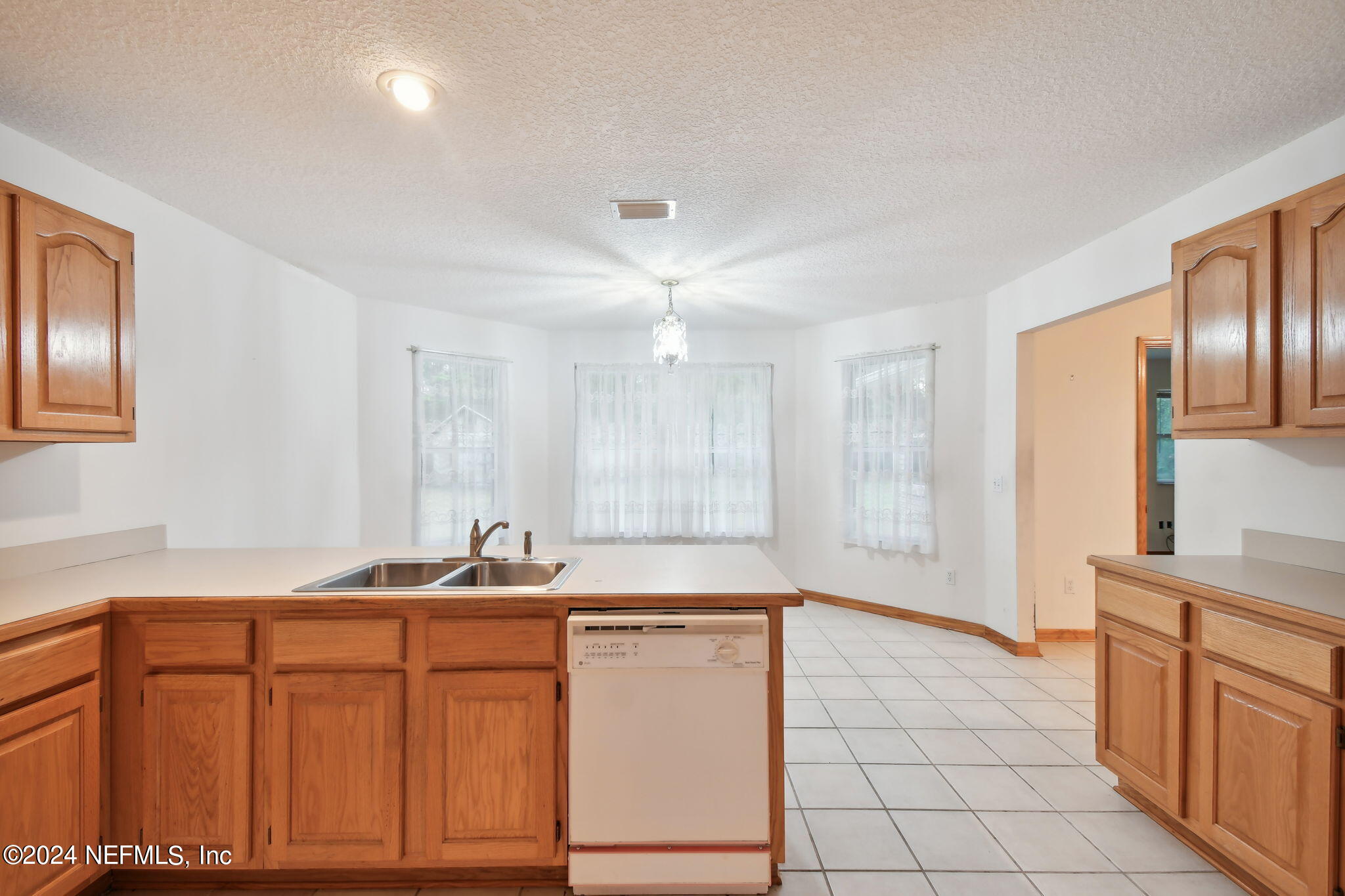 36068 J W Elliott Road Callahan, FL 32011 - Photo 23 of 54 a bathroom with a sink double vanity and a mirror