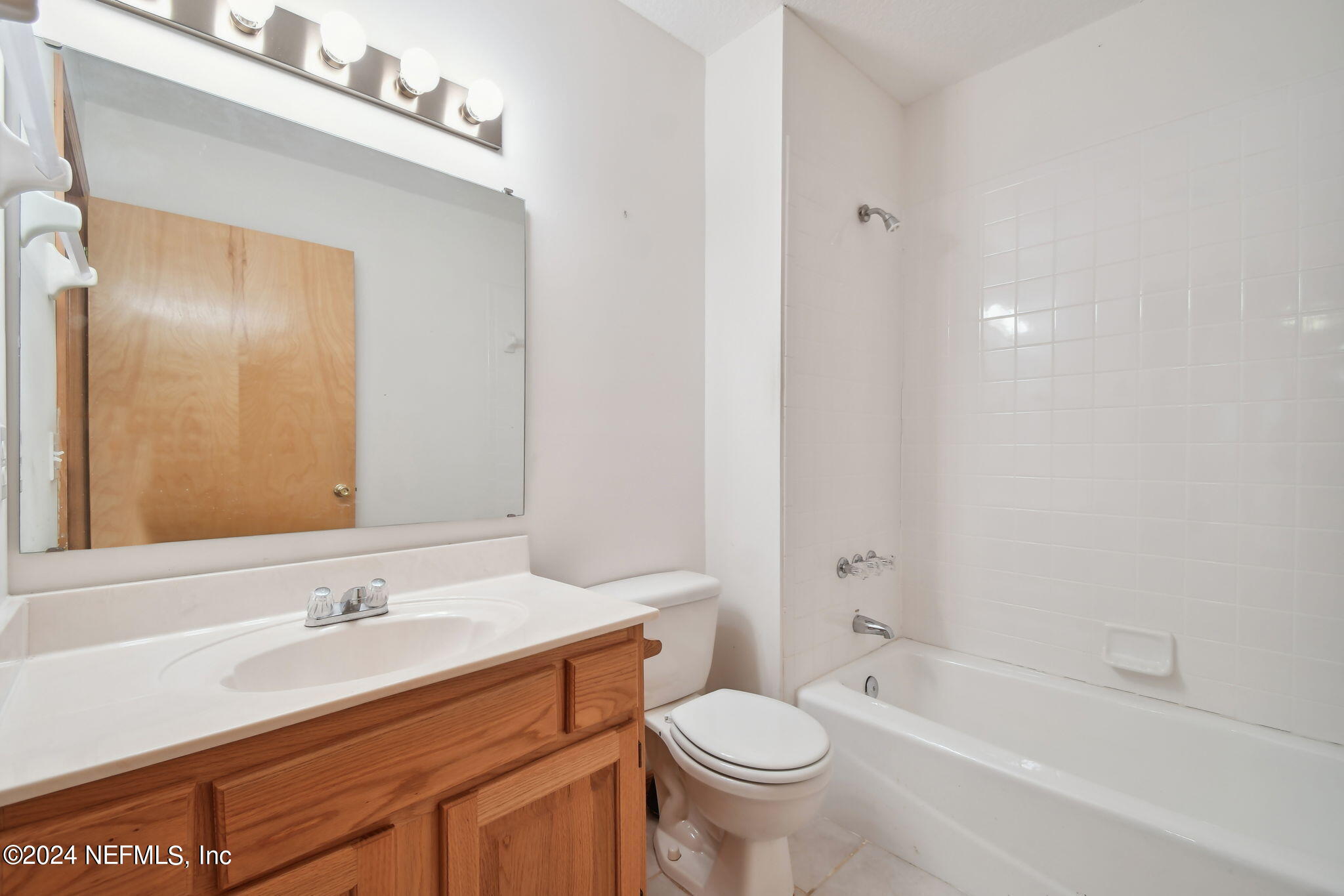 36068 J W Elliott Road Callahan, FL 32011 - Photo 32 of 54 a bathroom with a sink a toilet and shower