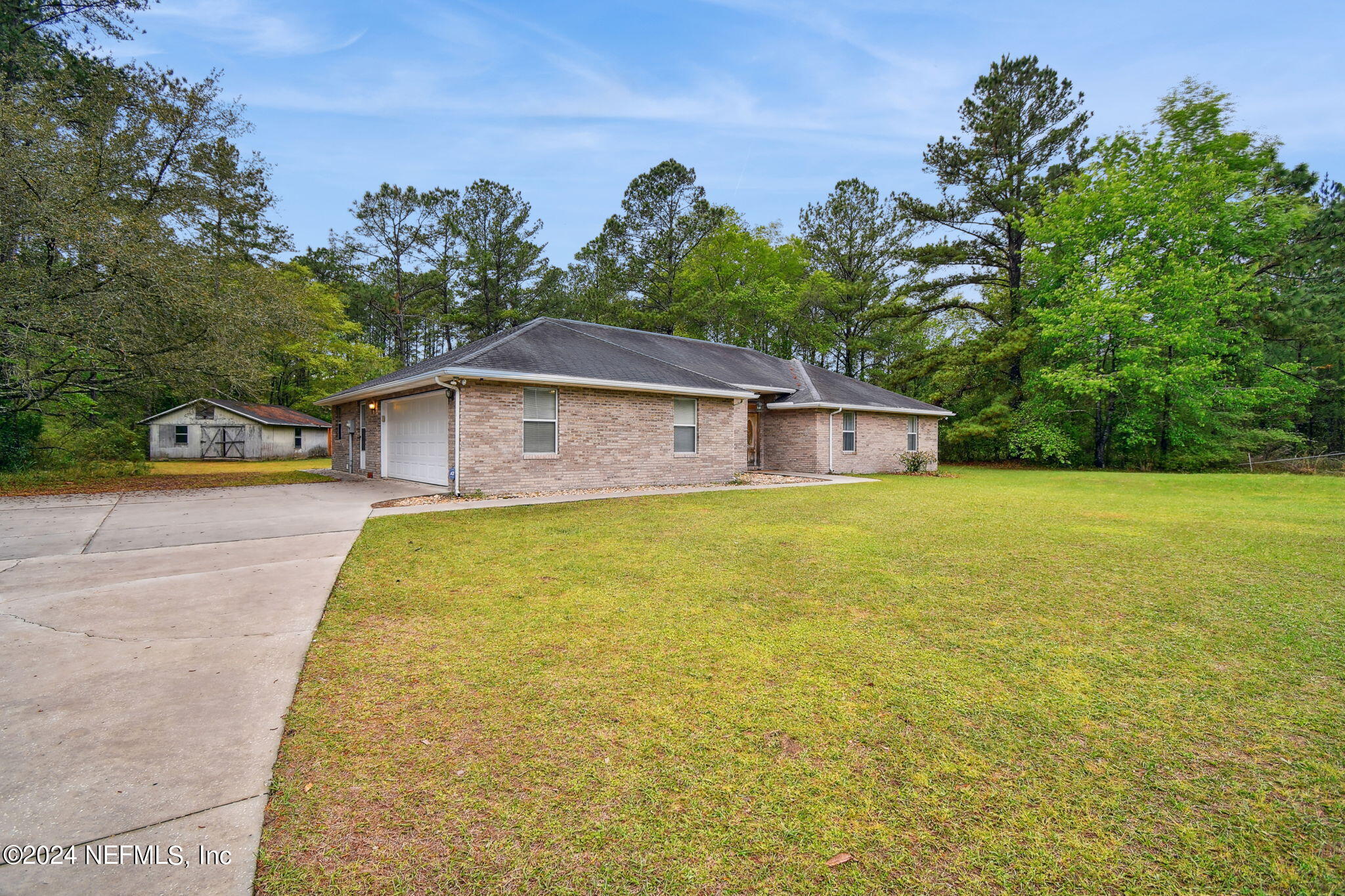 36068 J W Elliott Road Callahan, FL 32011 - Photo 4 of 54 a house view with swimming pool in front of it