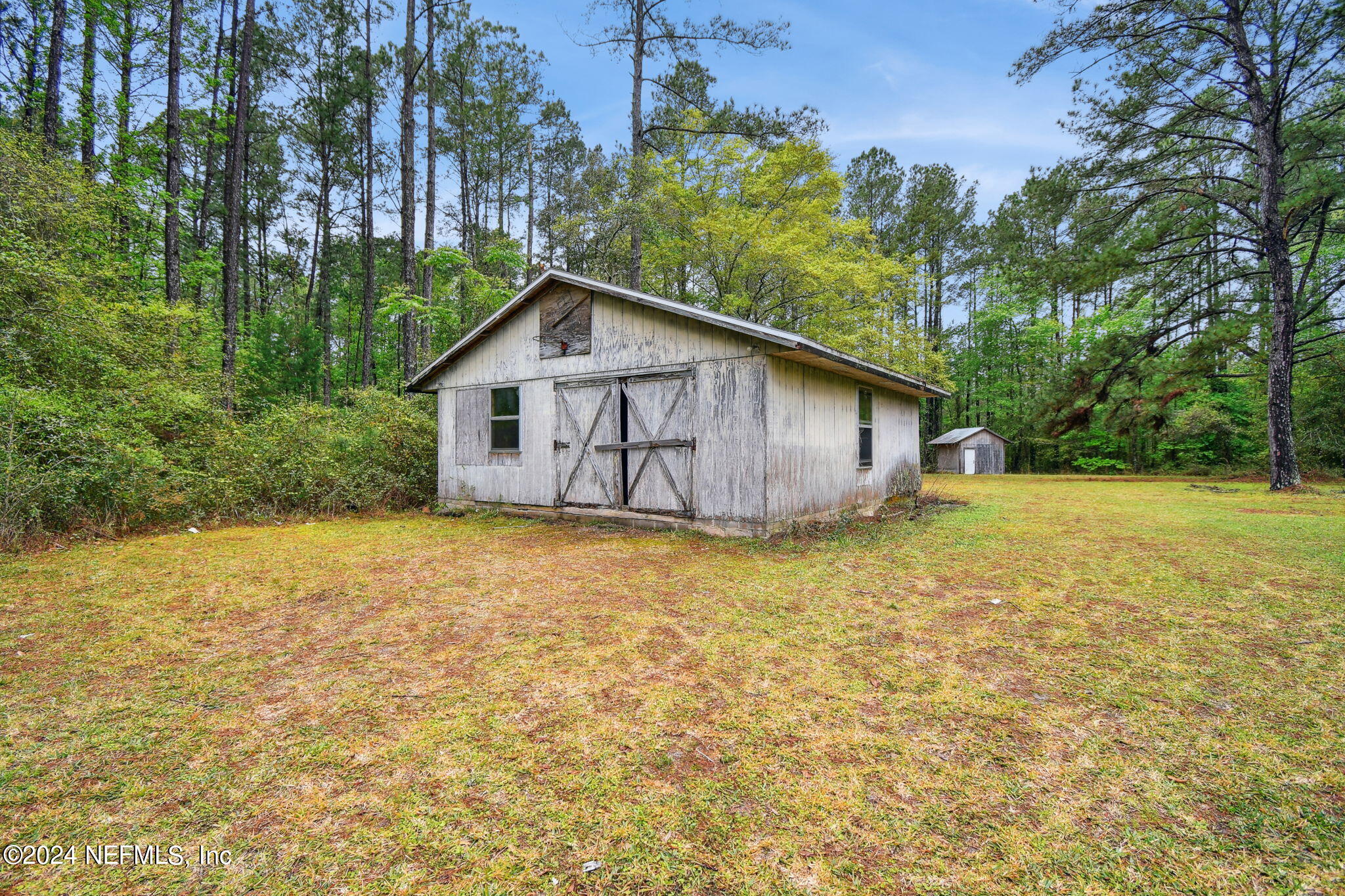 36068 J W Elliott Road Callahan, FL 32011 - Photo 45 of 54 a view of a house with backyard and garden