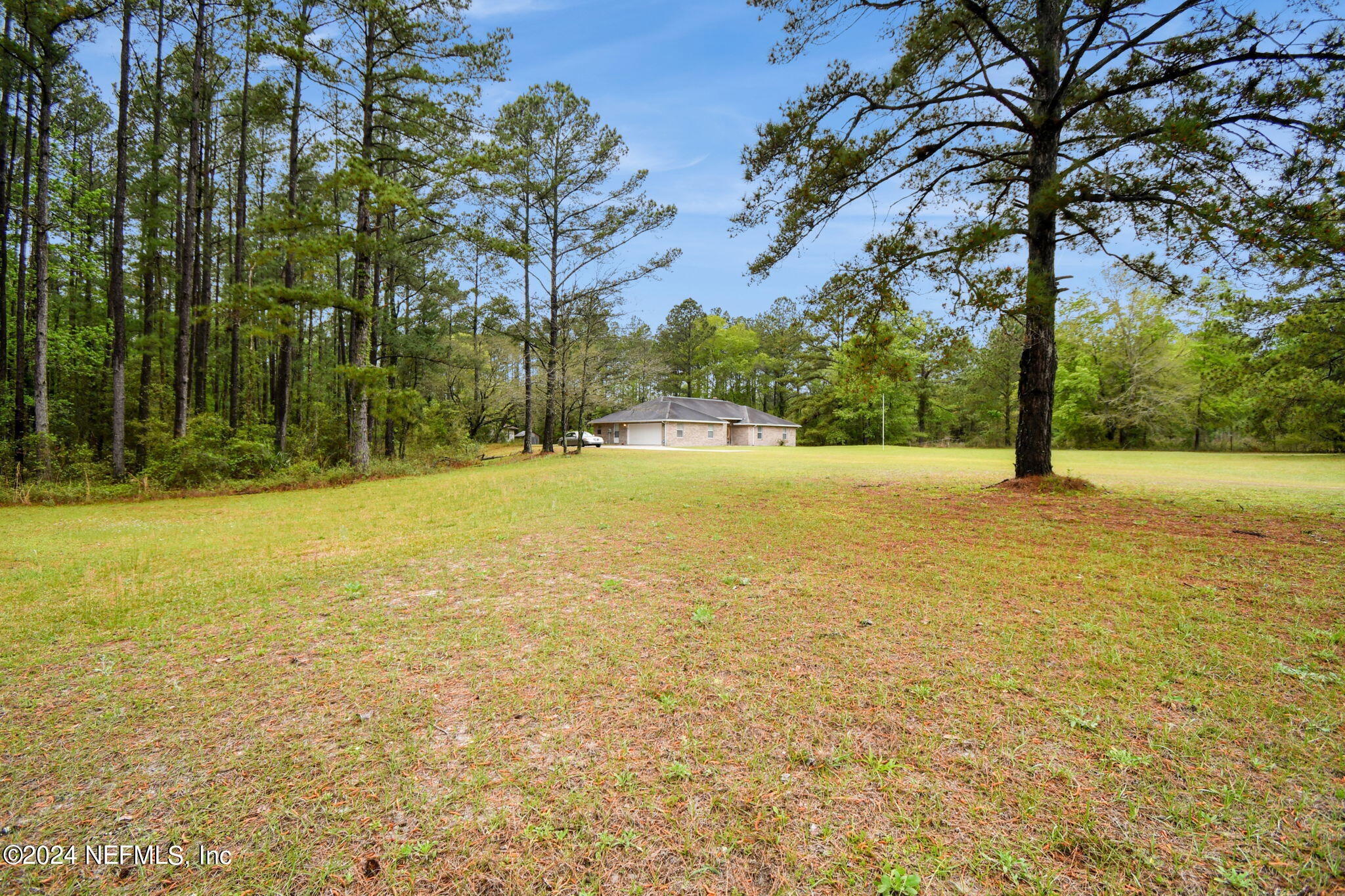 36068 J W Elliott Road Callahan, FL 32011 - Photo 47 of 54 a view of an ocean with large trees